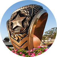 A bronze, 12-foot-tall replica of an Aggie ring.