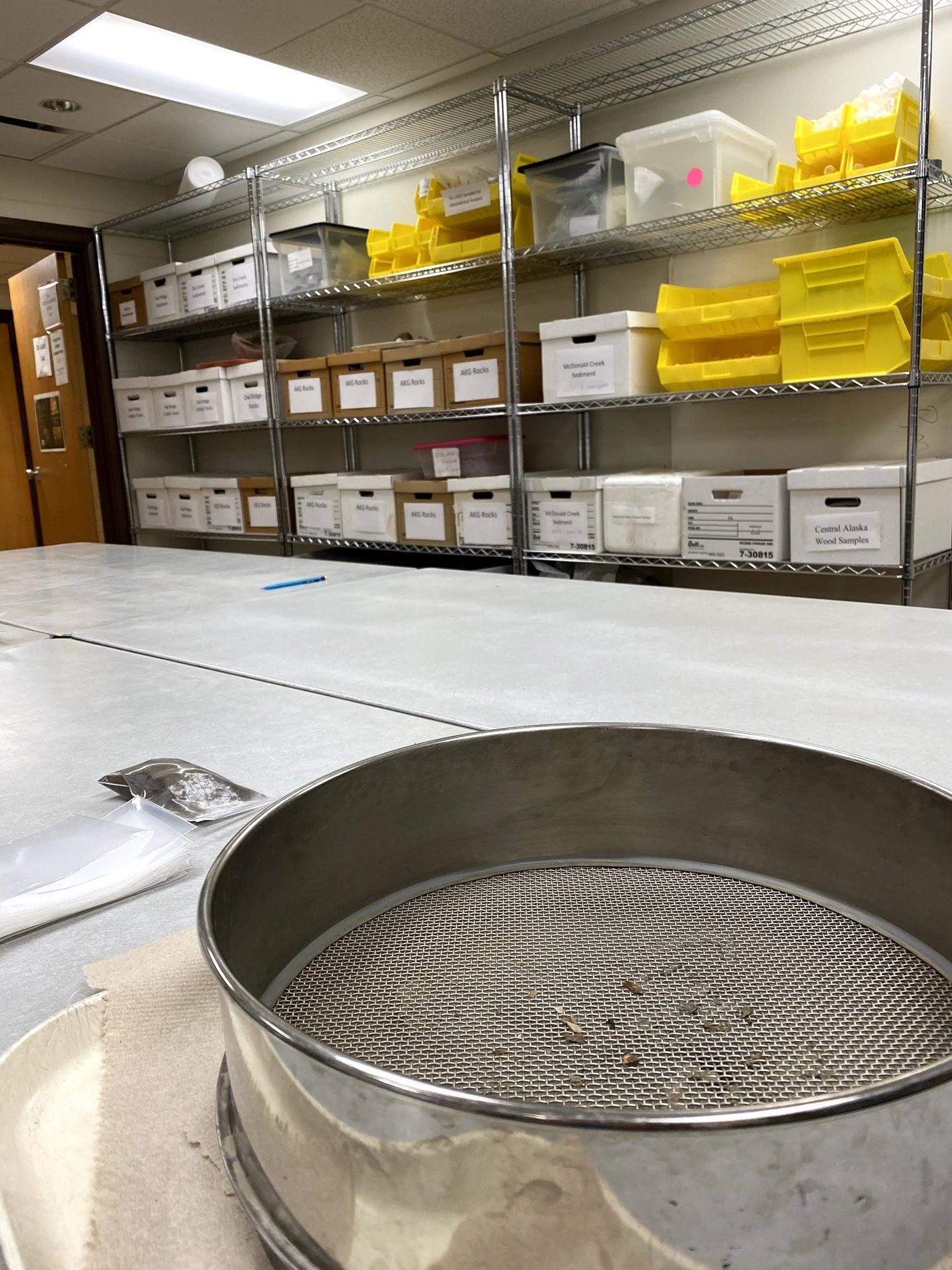 Anthropology pan in a lab with dirt in it.
